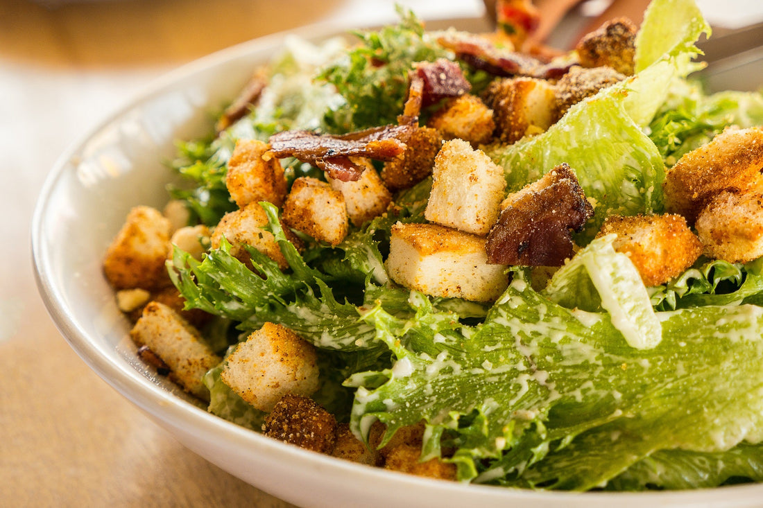 Caesar Salad with croutons and Parmesan in crazy sauce